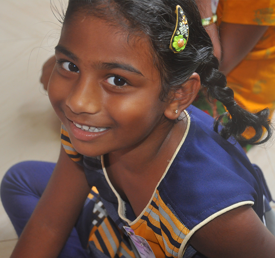 prudhvi moses and Satya distributing exam pads to pothavaram school children